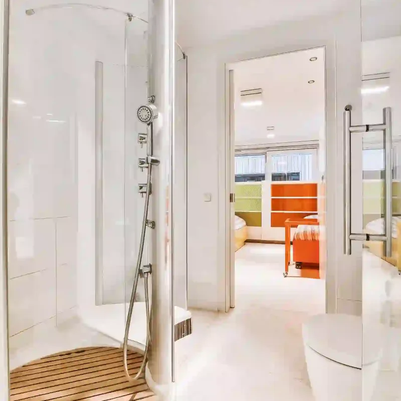 opened-doorway-leading-walk-through-shower-room-with-toilet-bedroom_305343-404